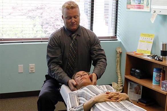 Chiropractor William Jackson Adjusting Patient